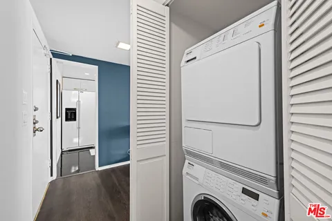 a view of livingroom with washer and dryer