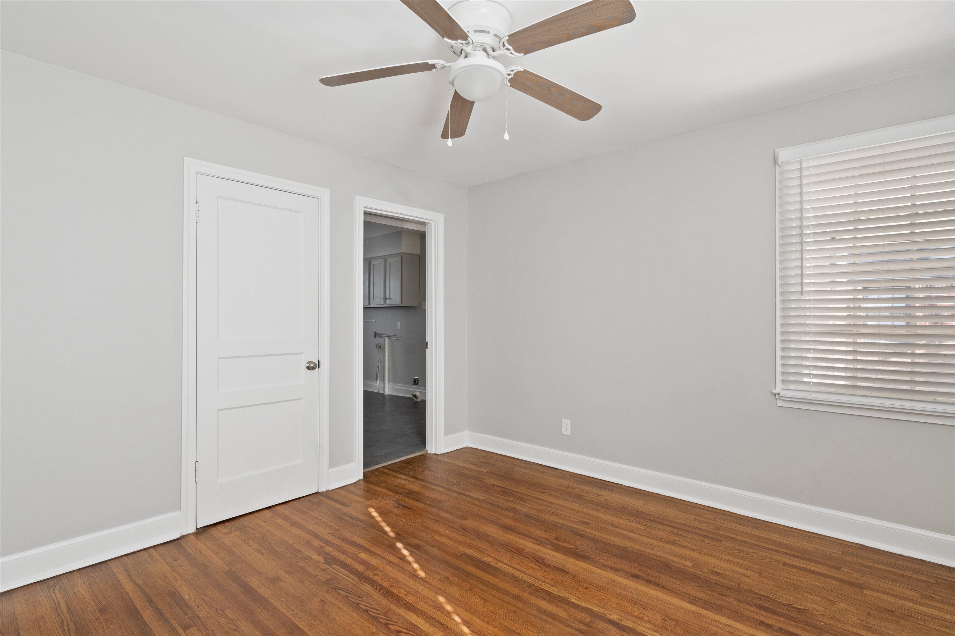 3753 Friar Tuck Road Memphis, TN 38111 - Photo 12 of 21 a view of empty room with wooden floor and fan