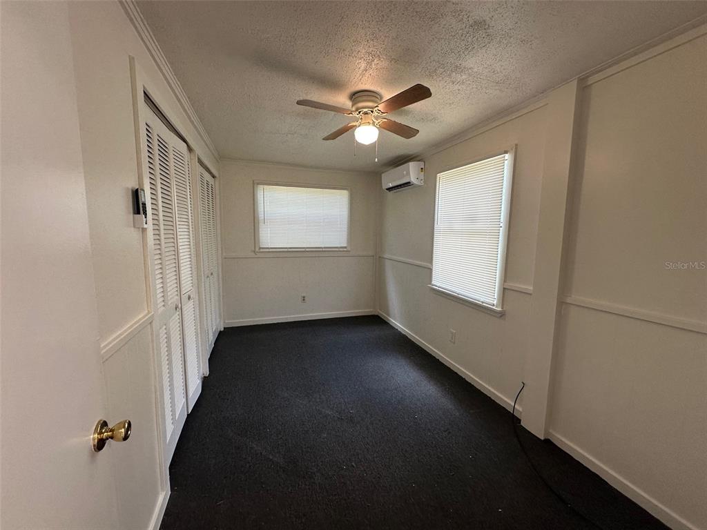 407 Poinsettia Road Daytona Beach, FL 32118 - Photo 6 of 10 a view of an empty room with a window