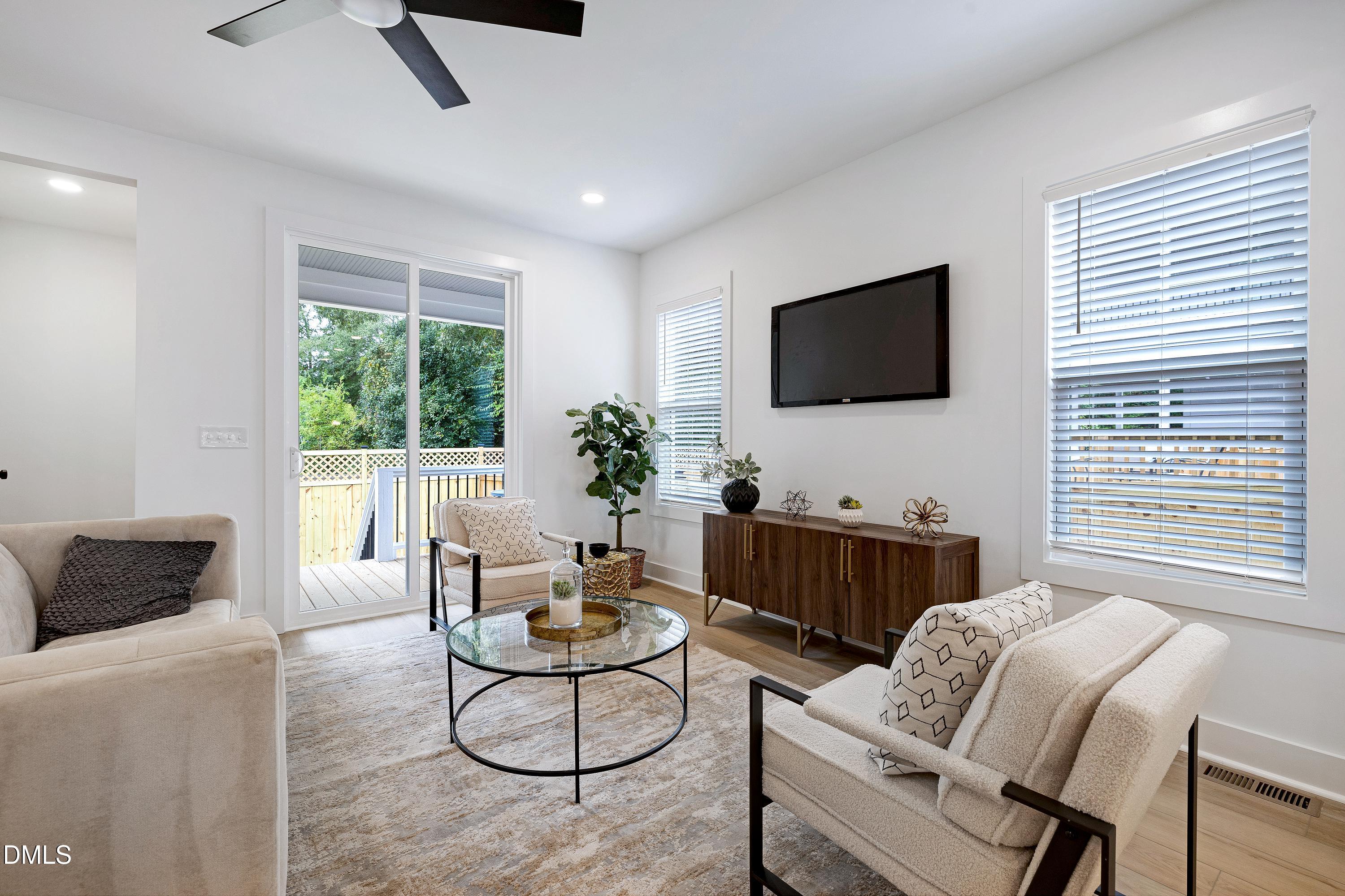 1418 Joe Louis Avenue Raleigh, NC 27610 - Photo 18 of 49 a living room with furniture and a flat screen tv