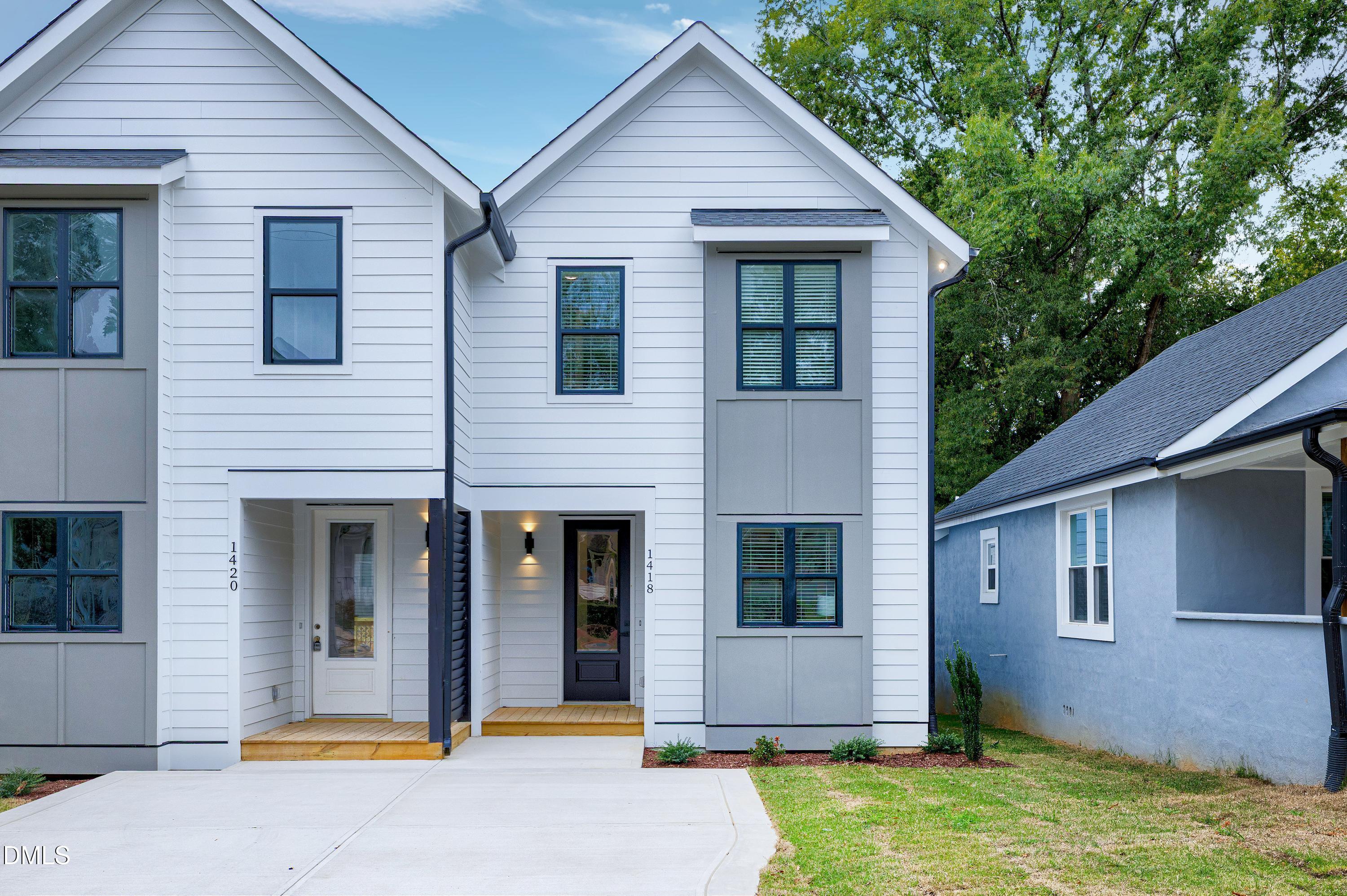 1418 Joe Louis Avenue Raleigh, NC 27610 - Photo 2 of 49 a view of a yard in front of house