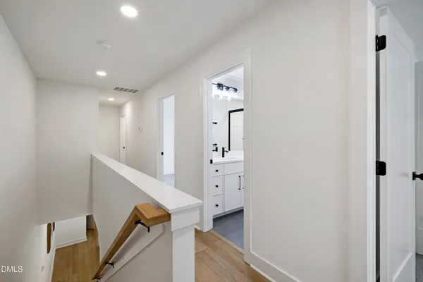 a view of a hallway with staircase