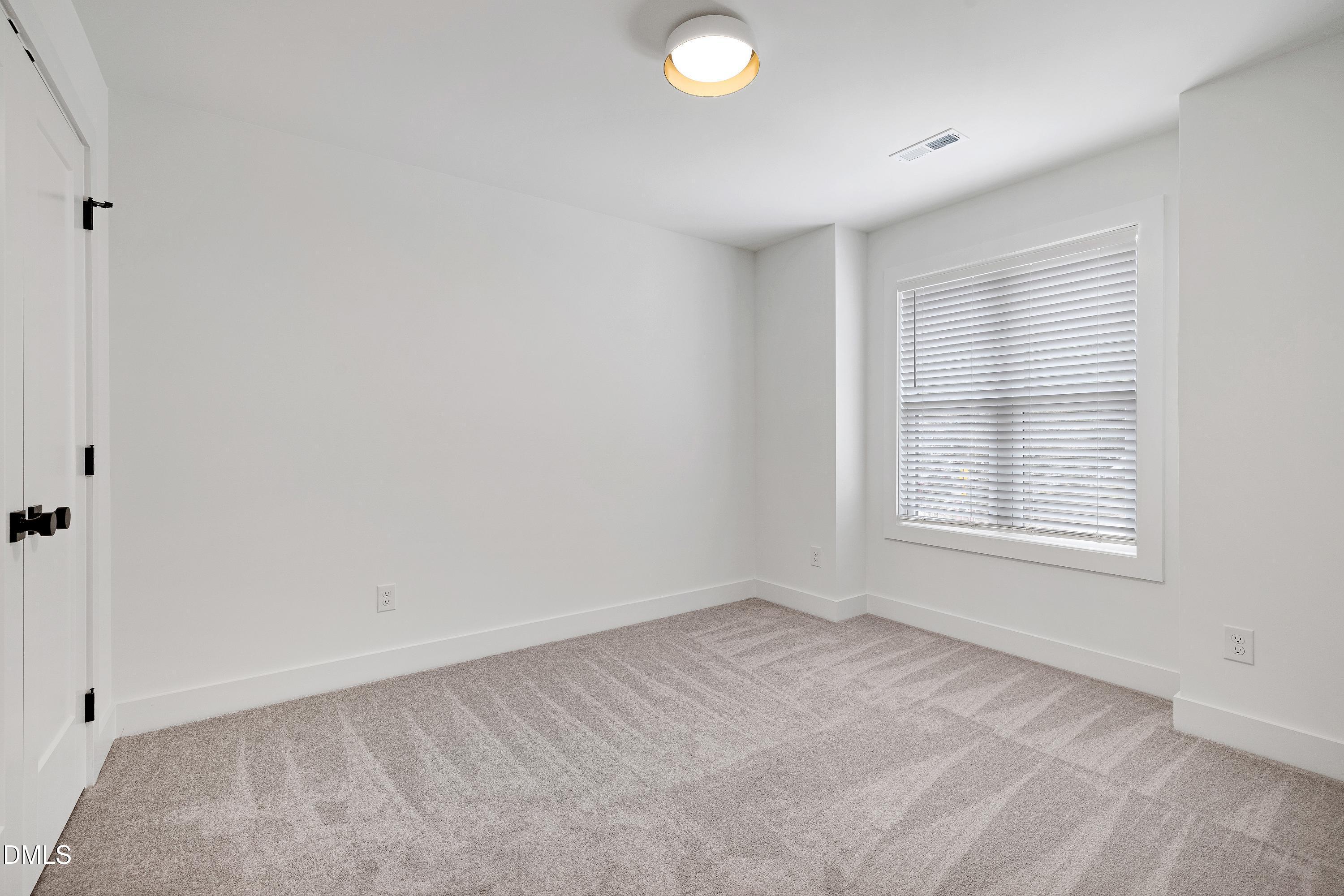 1418 Joe Louis Avenue Raleigh, NC 27610 - Photo 31 of 49 an empty room with a window