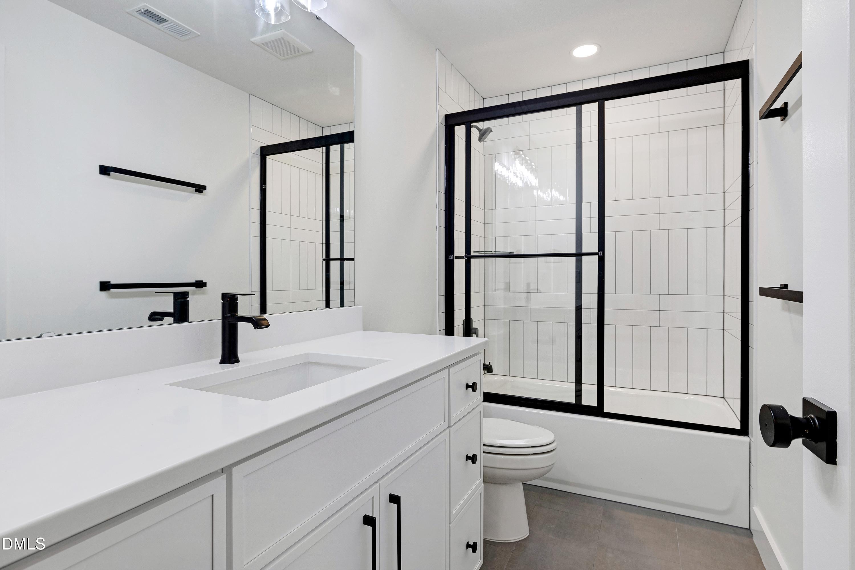 1418 Joe Louis Avenue Raleigh, NC 27610 - Photo 33 of 49 a bathroom with a sink toilet and shower