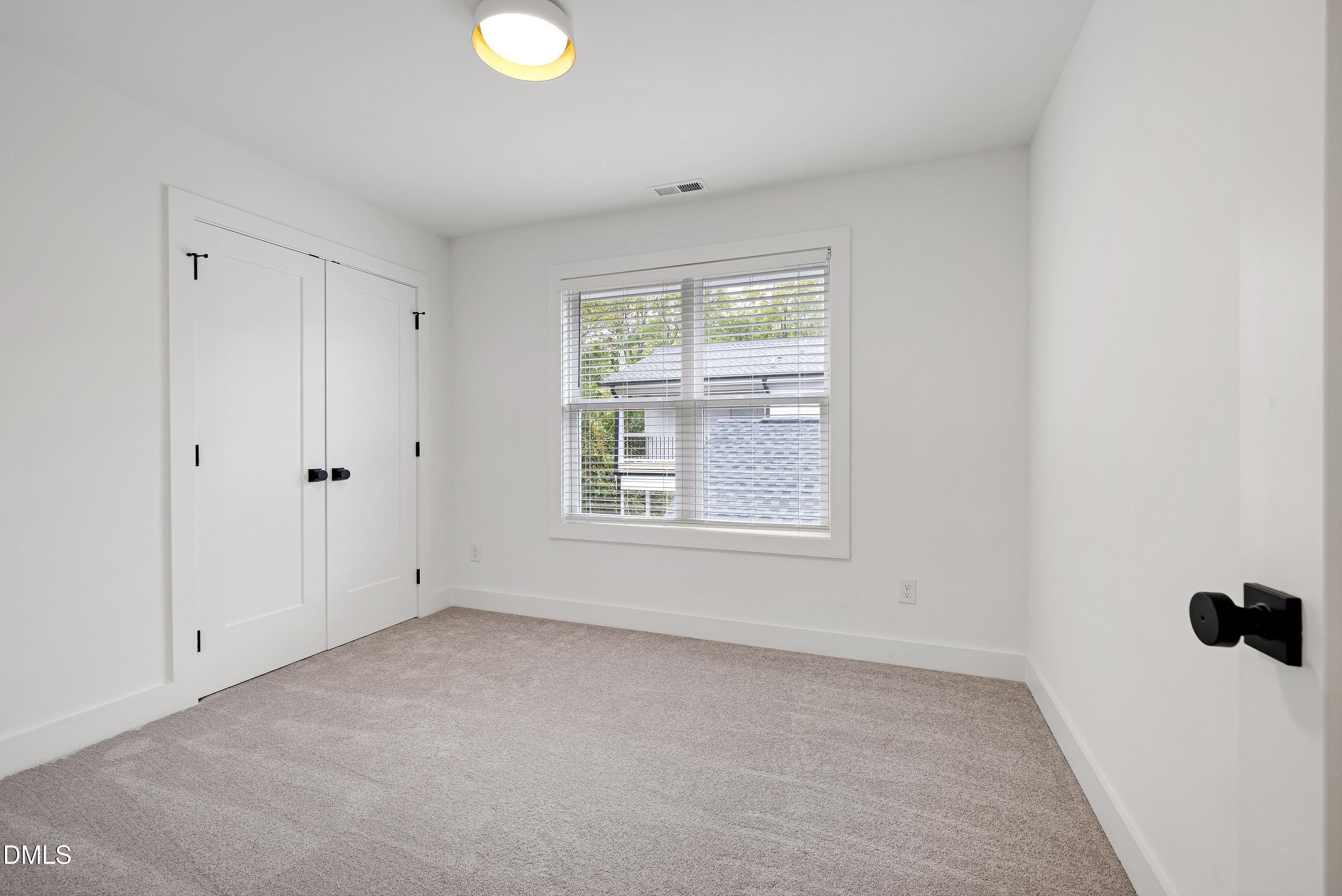 1418 Joe Louis Avenue Raleigh, NC 27610 - Photo 35 of 49 a view of an empty room with a window