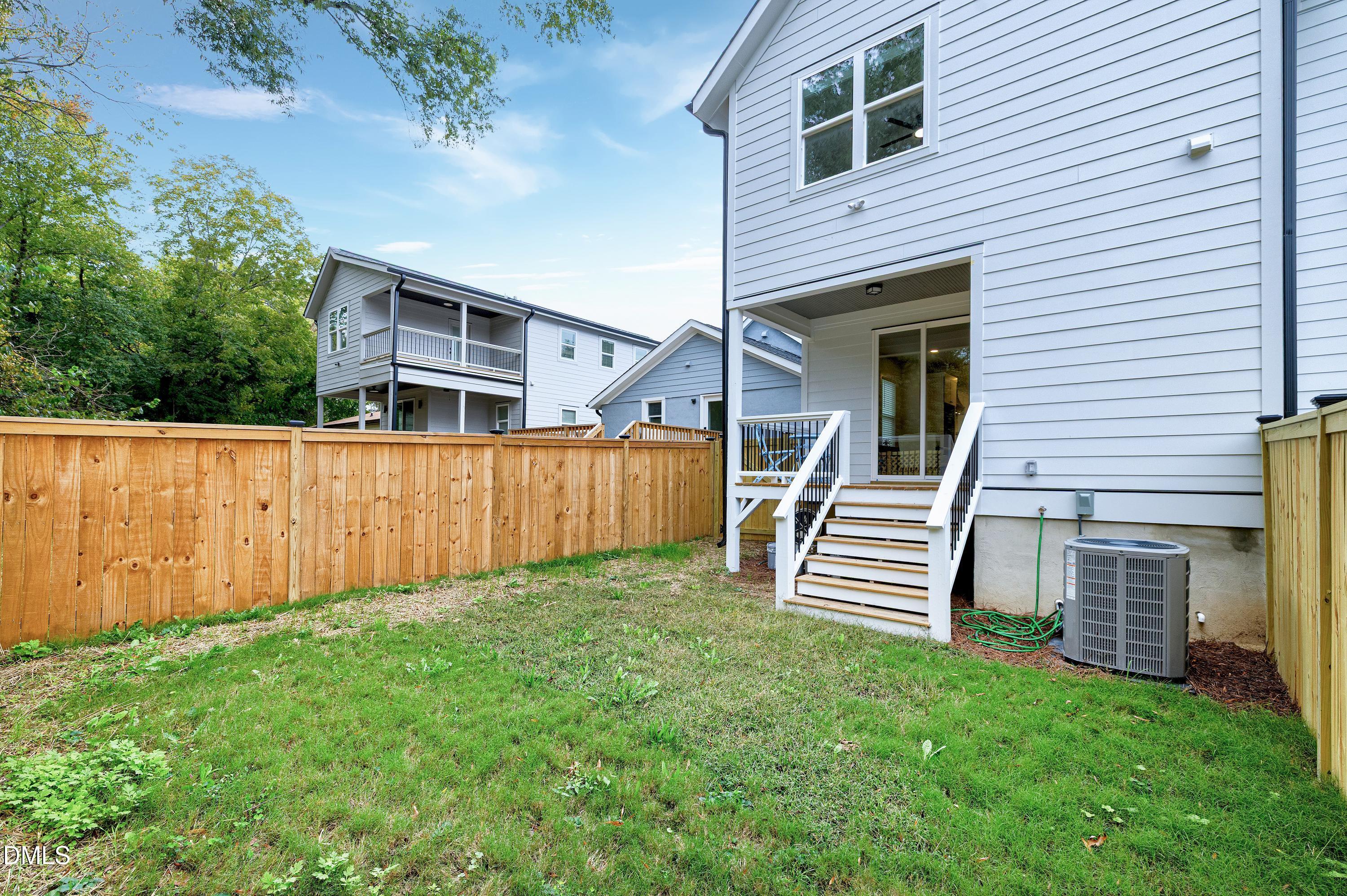 1418 Joe Louis Avenue Raleigh, NC 27610 - Photo 41 of 49 a front view of a house with a yard