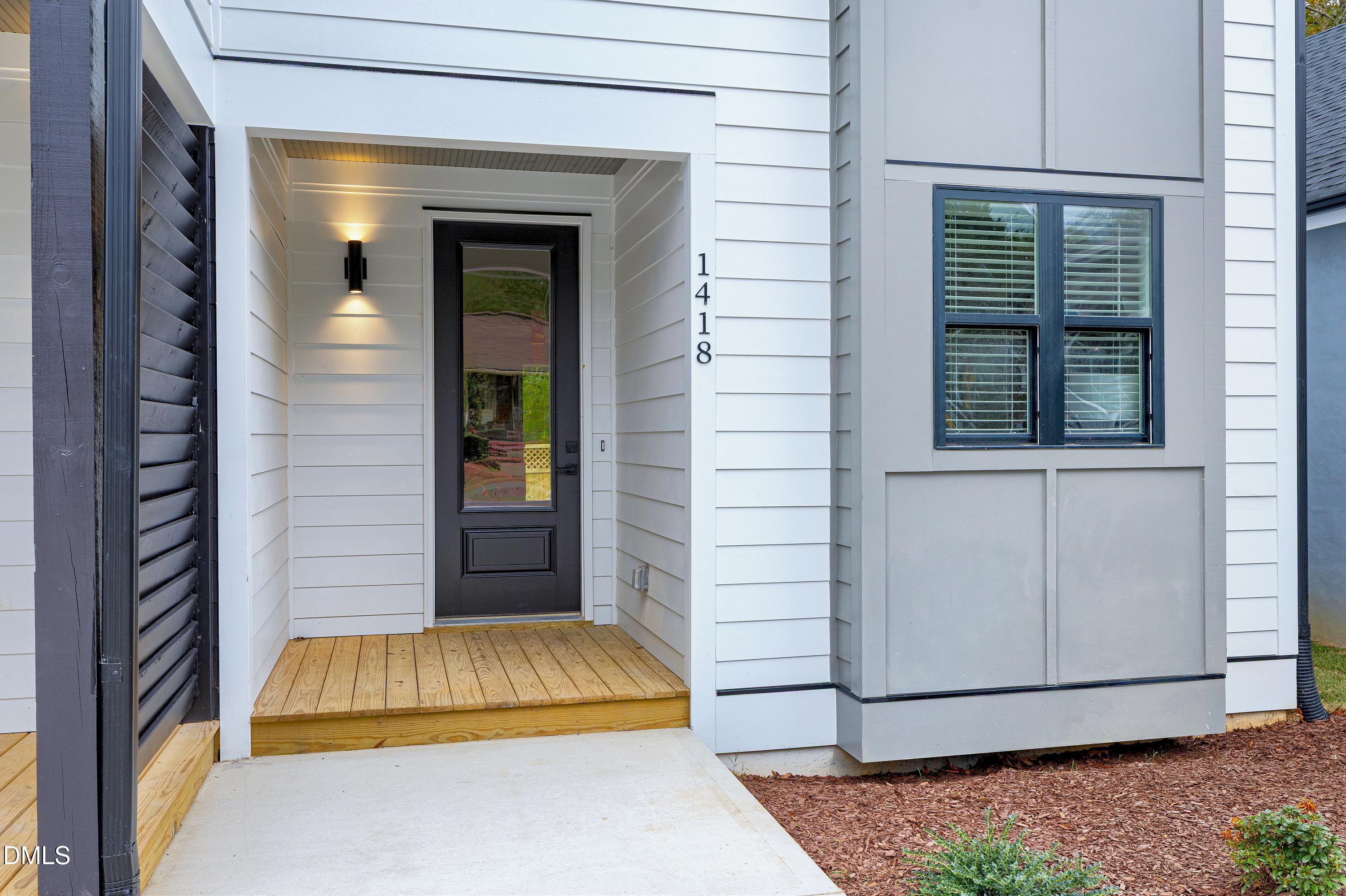 1418 Joe Louis Avenue Raleigh, NC 27610 - Photo 4 of 49 a bedroom with a bed and a window