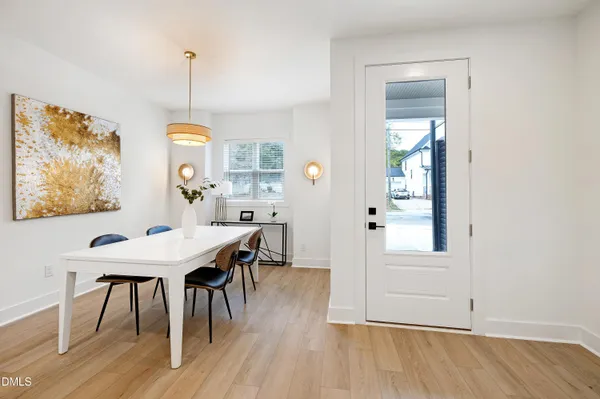 a view of a dining room with furniture window and wooden floor