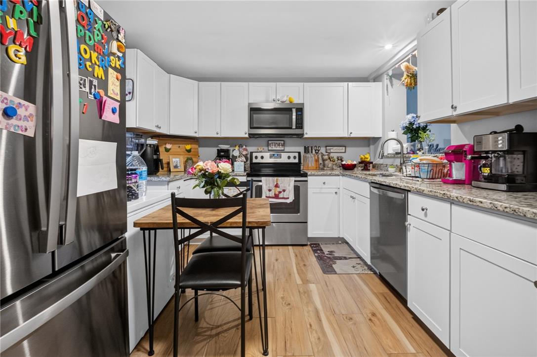 3123 Orefield Road Allentown, PA 18104 - Photo 19 of 39 A well-appointed kitchen features sleek stainless steel appliances and abundant white cabinetry, ready for culinary endeavors.
