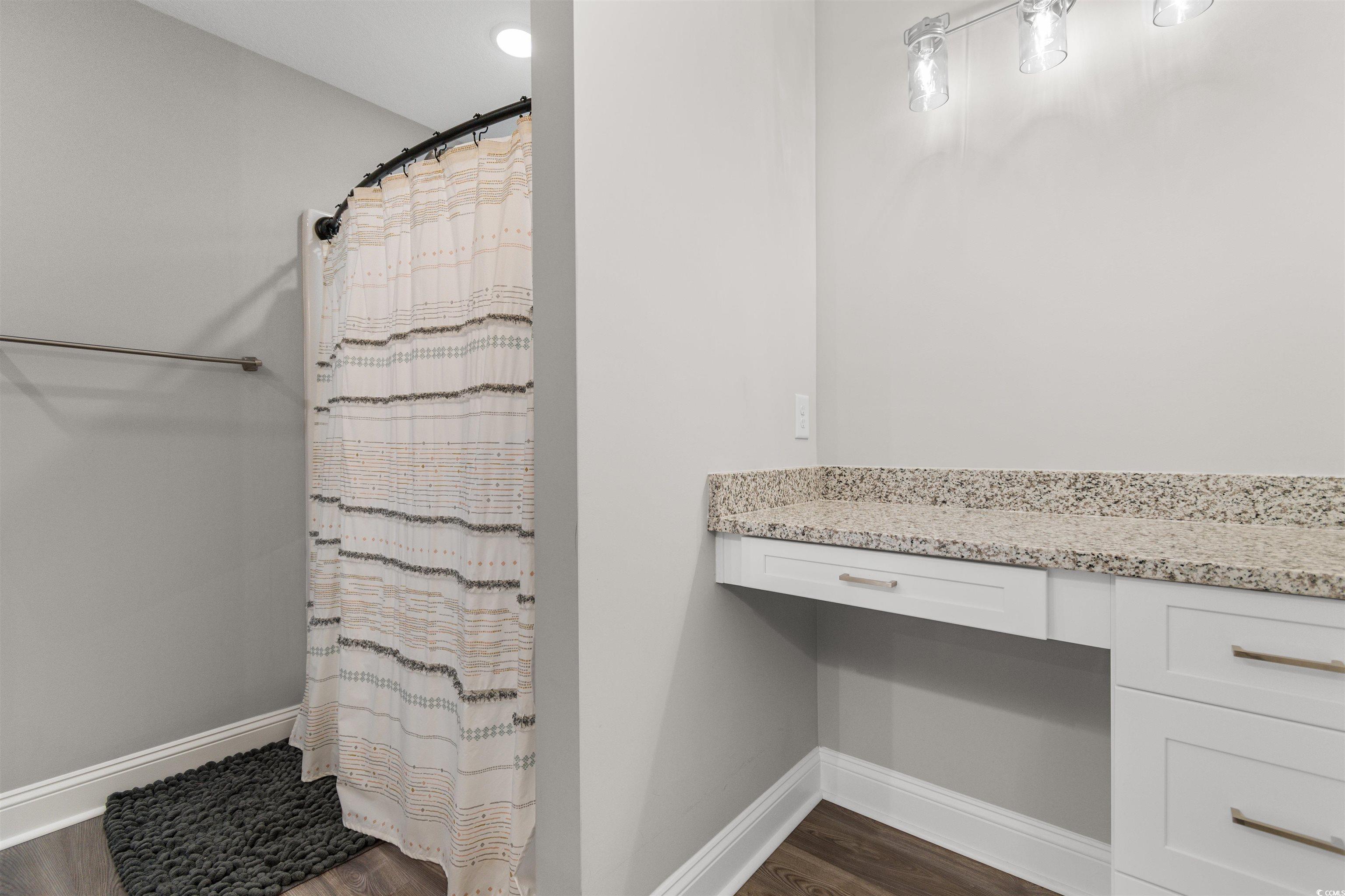 2299 Vaught Road Galivants Ferry, SC 29544 - Photo 19 of 40 Bathroom with walk in shower and wood-type floorin