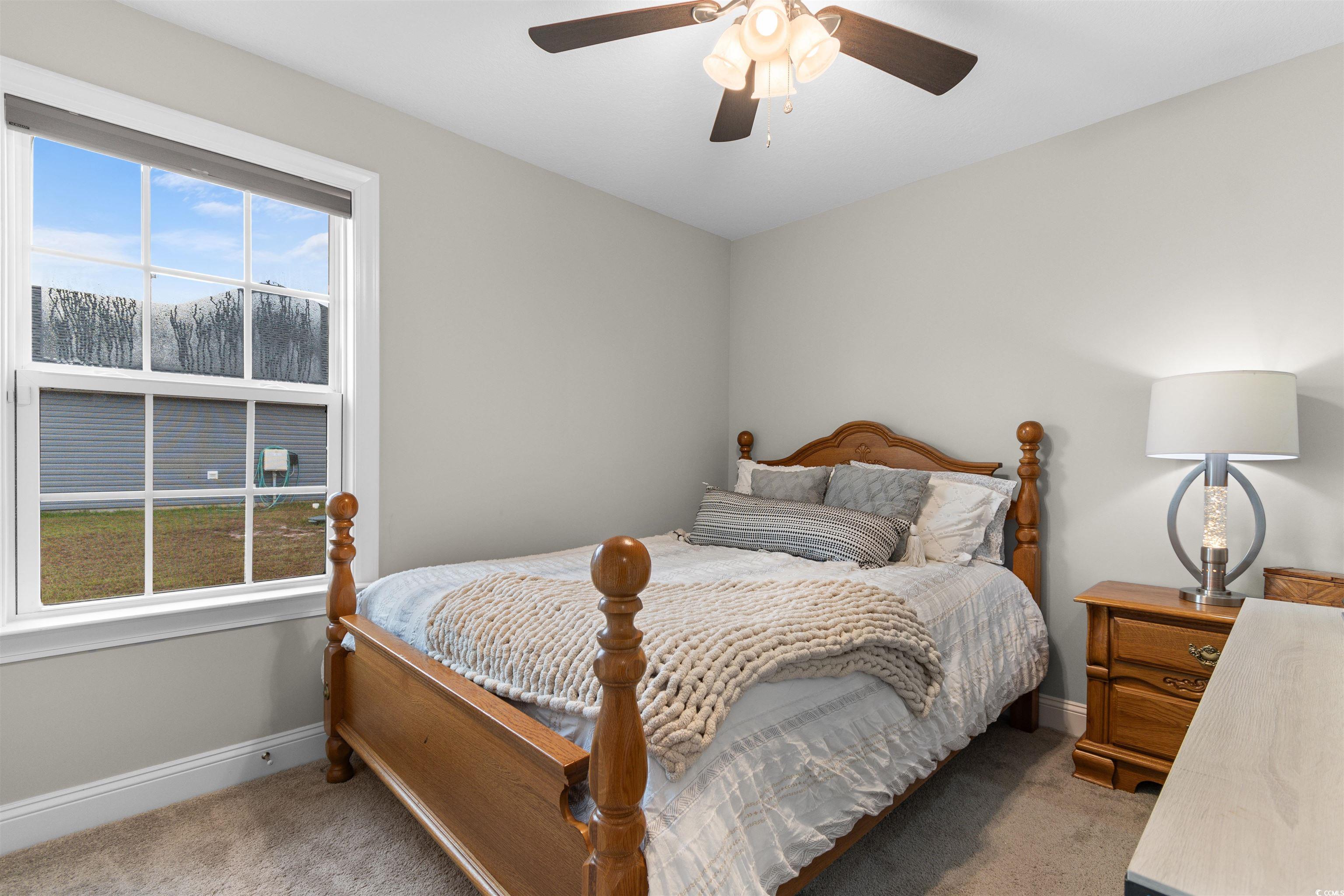 2299 Vaught Road Galivants Ferry, SC 29544 - Photo 20 of 40 Bedroom featuring carpet and ceiling fan