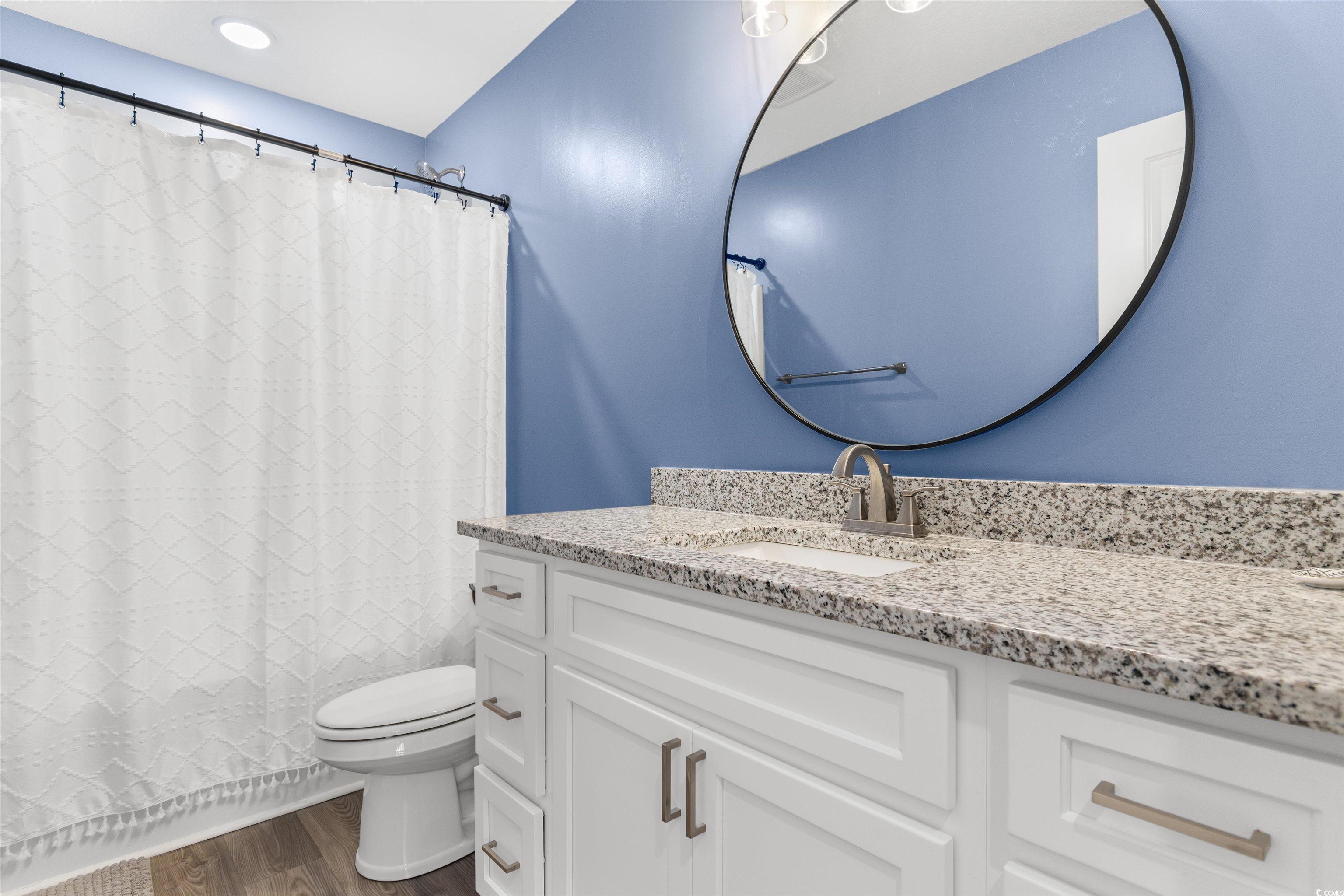 2299 Vaught Road Galivants Ferry, SC 29544 - Photo 21 of 40 Bathroom featuring vanity, hardwood / wood-style f