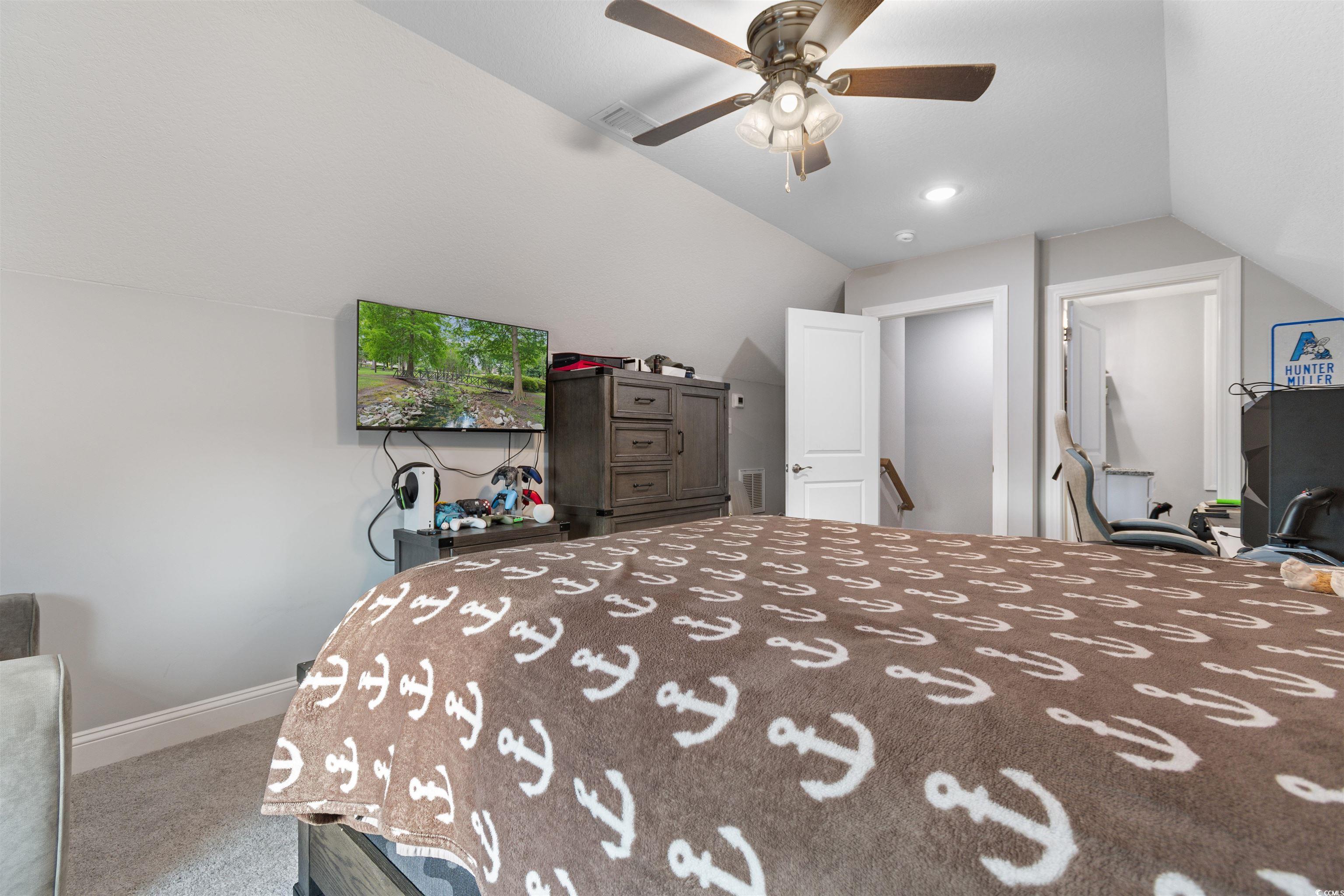 2299 Vaught Road Galivants Ferry, SC 29544 - Photo 25 of 40 Bedroom with carpet flooring, lofted ceiling, and