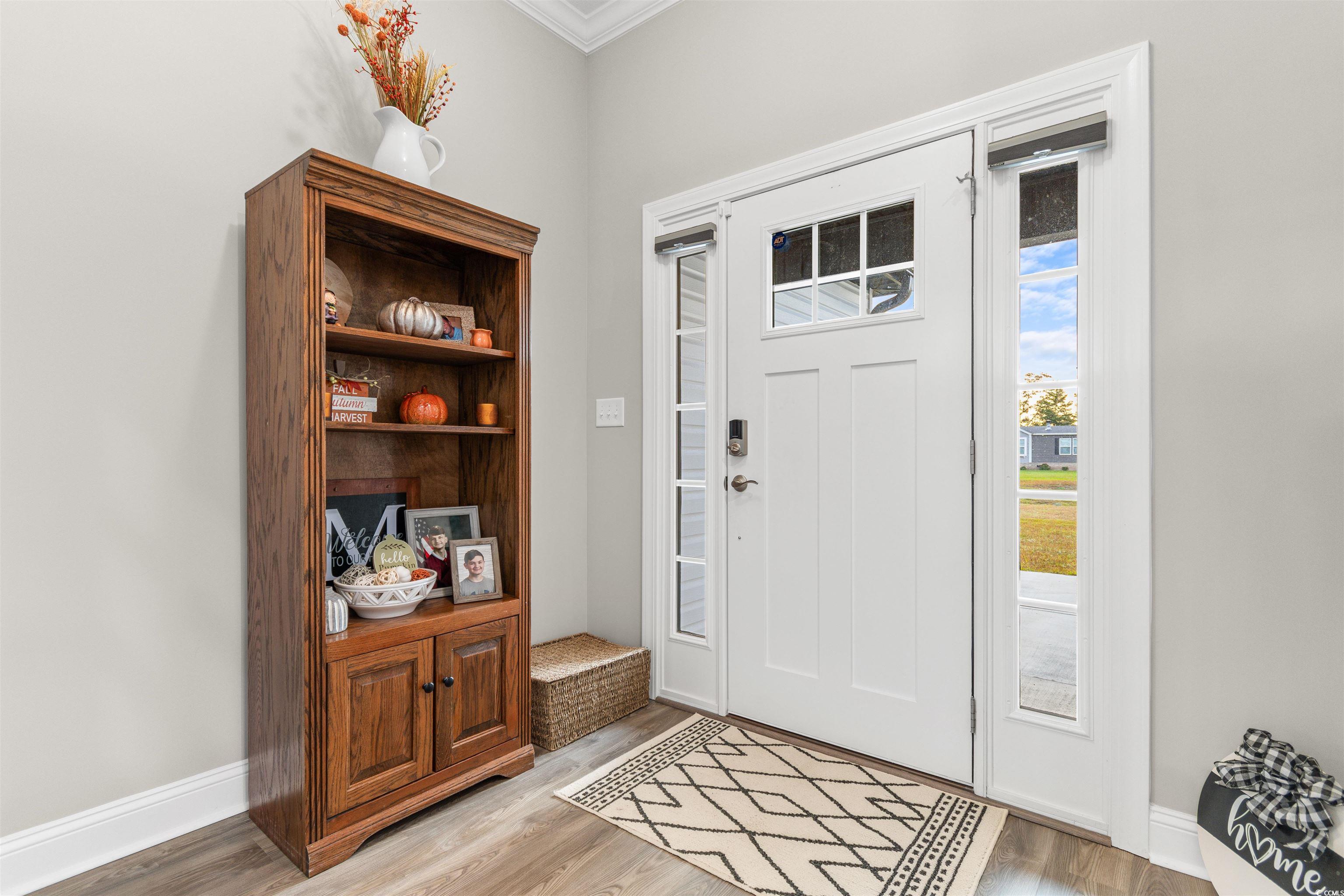2299 Vaught Road Galivants Ferry, SC 29544 - Photo 29 of 40 Foyer featuring ornamental molding and light hardw