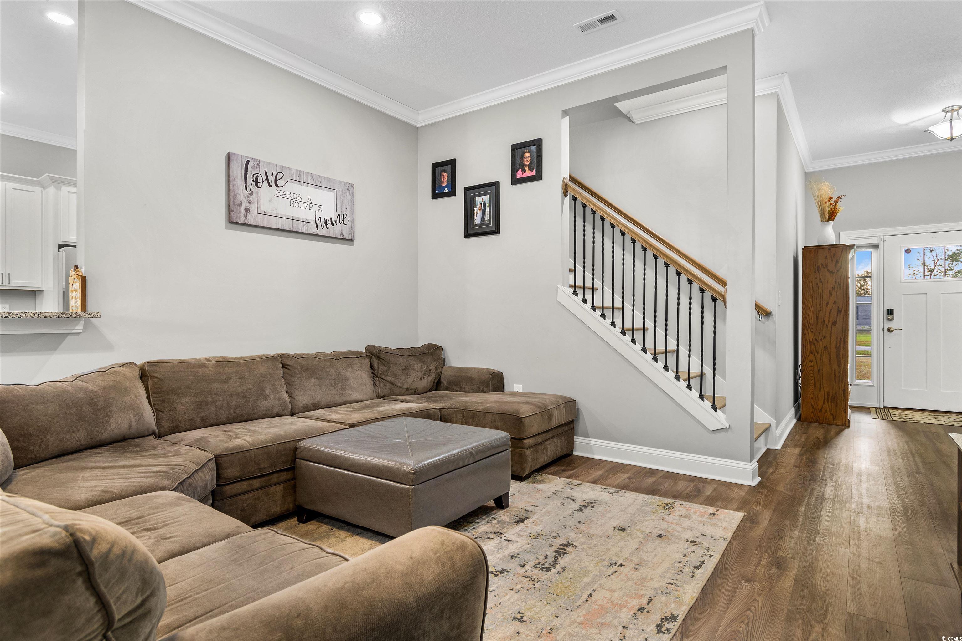 2299 Vaught Road Galivants Ferry, SC 29544 - Photo 4 of 40 Living room featuring wood-type flooring and ornam