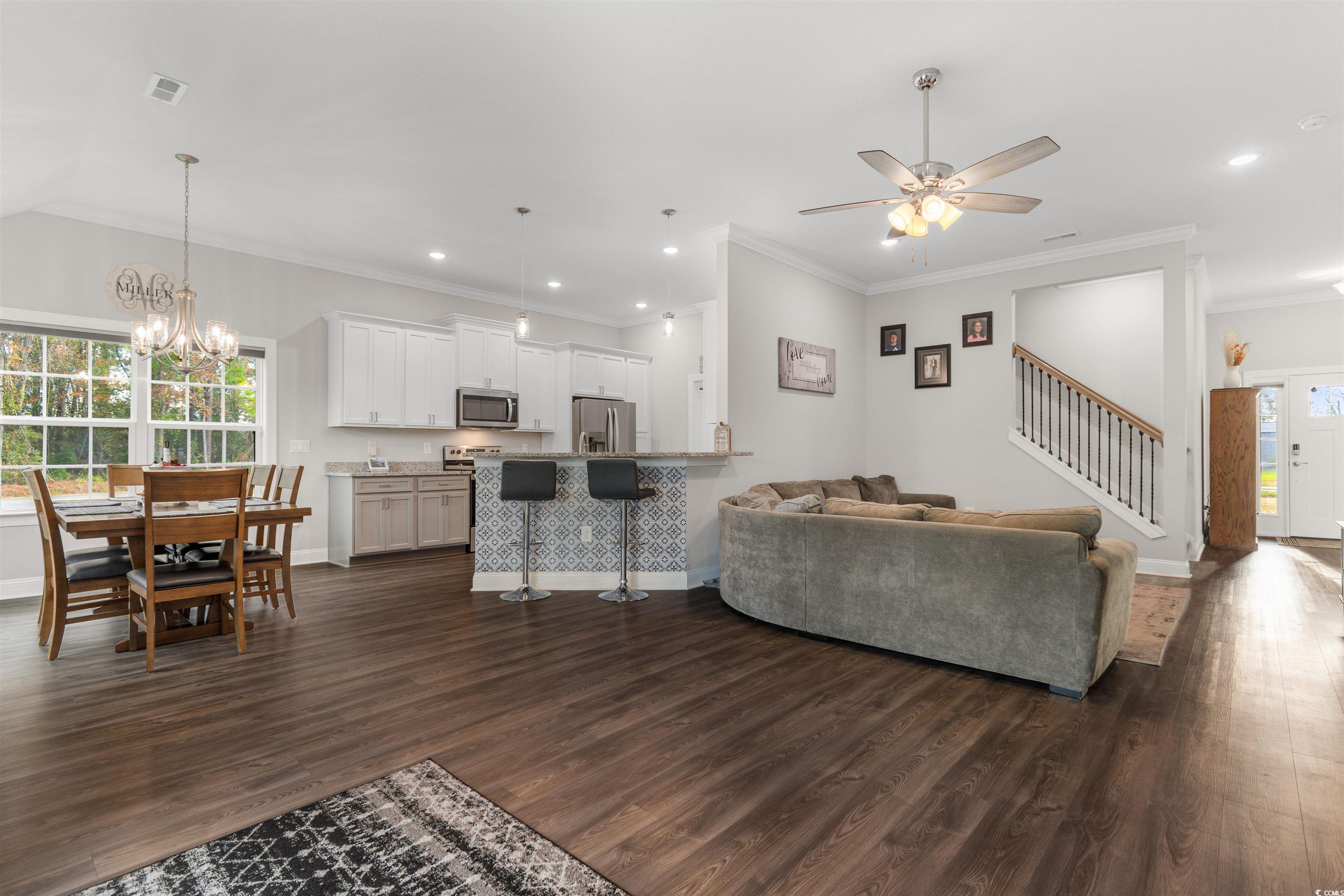 2299 Vaught Road Galivants Ferry, SC 29544 - Photo 5 of 40 Living room with ornamental molding, ceiling fan w