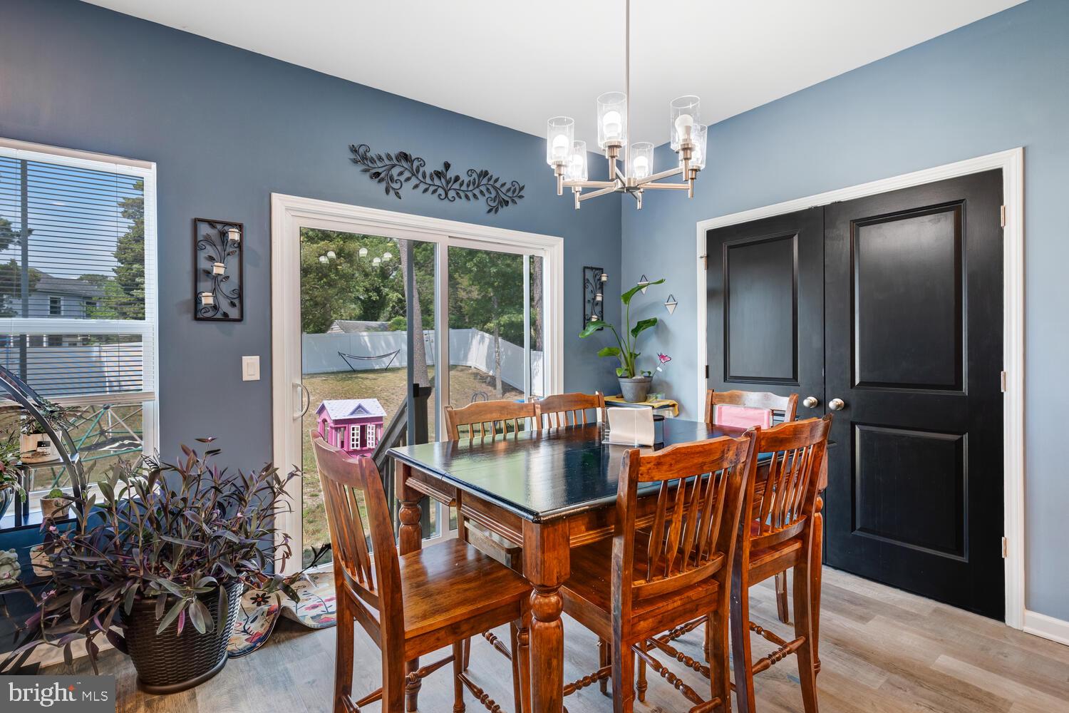 107 Sandpiper Lane Little Egg Harbor, NJ 08087 - Photo 15 of 40 a dining room with furniture a chandelier and window