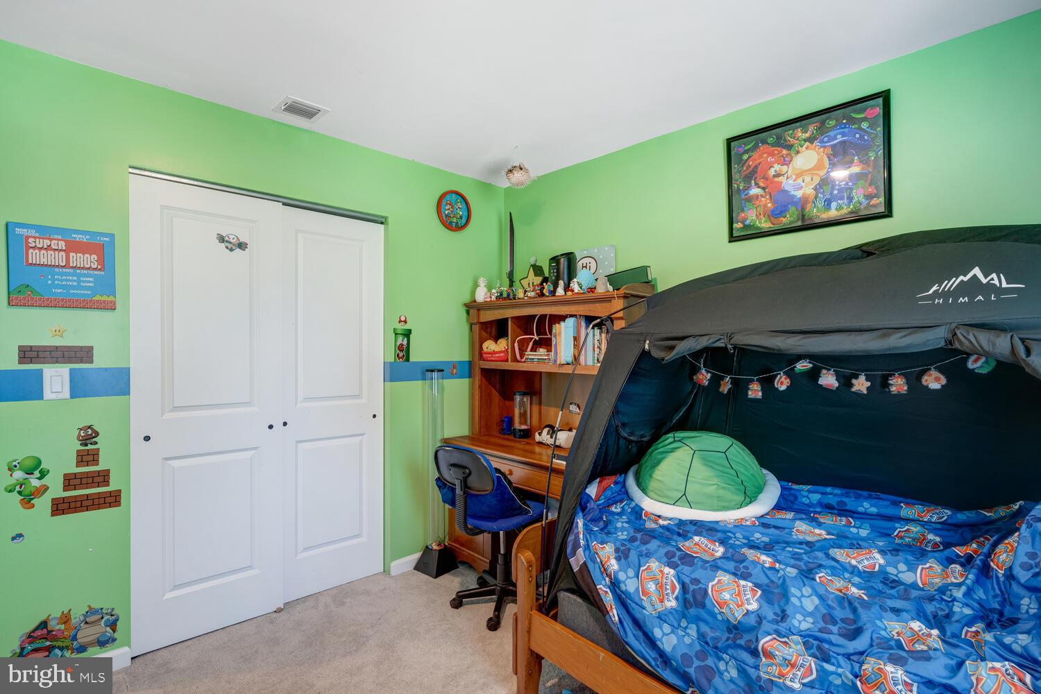 107 Sandpiper Lane Little Egg Harbor, NJ 08087 - Photo 31 of 40 a bed room with a bed and a chair