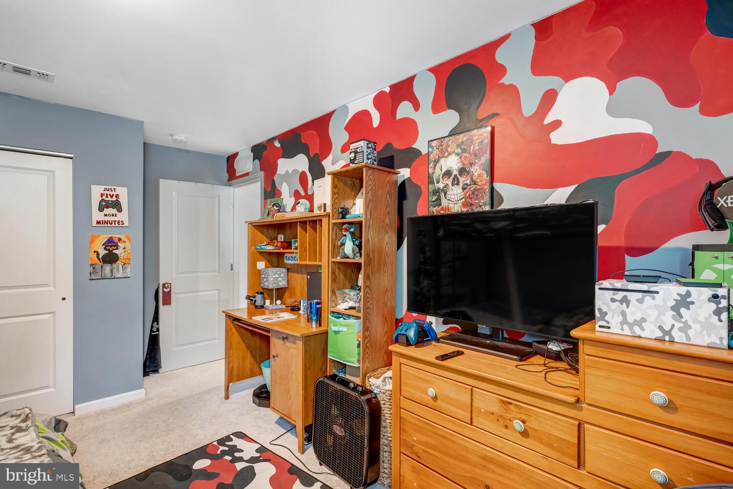 107 Sandpiper Lane Little Egg Harbor, NJ 08087 - Photo 34 of 40 a room with furniture and flat screen tv