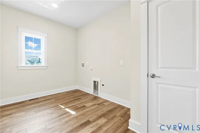 a view of a room with wooden floor and closet