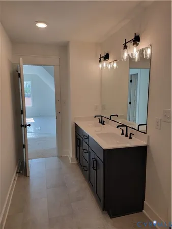 a utility room with a sink dryer and washer