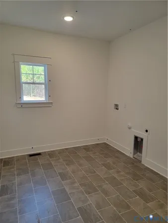 an empty room with a bathroom