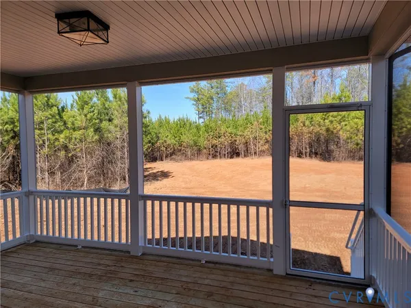 a view of a room with wooden floor and outdoor space
