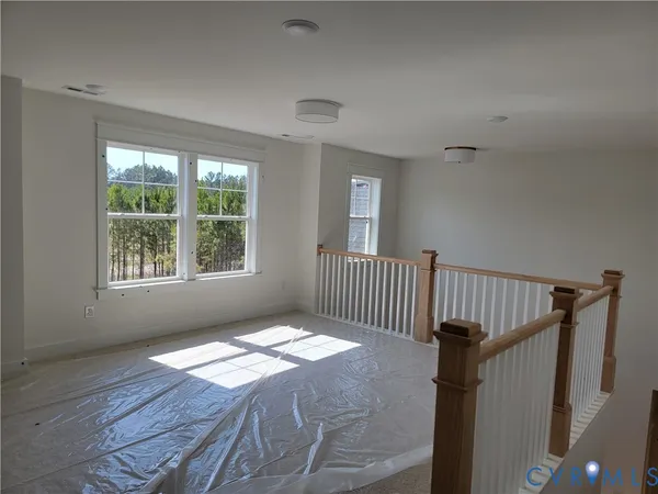 a bedroom with bed and a window