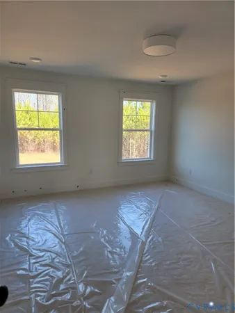 a view of an empty room with a window