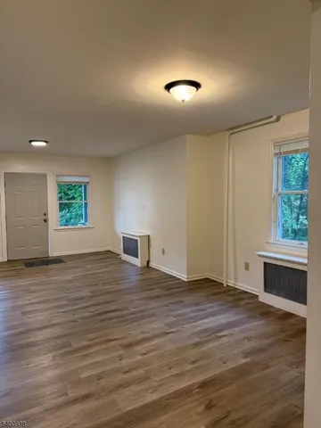 a bathroom with a toilet sink and window