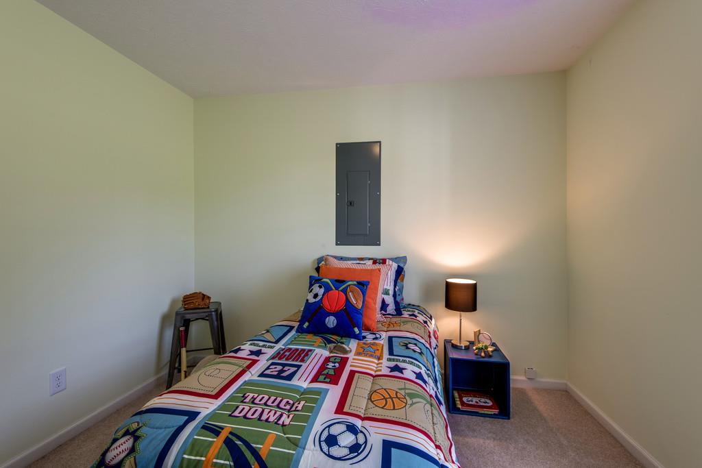 1427 St Paul Road Charlotte, TN 37036 - Photo 22 of 27 a bed room with furniture and clutter