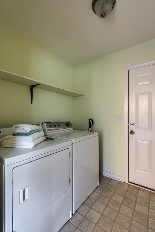 1427 St Paul Road Charlotte, TN 37036 - Photo 24 of 27 a utility room with dryer and washer