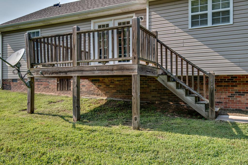 1427 St Paul Road Charlotte, TN 37036 - Photo 26 of 27 a view of house with backyard and deck