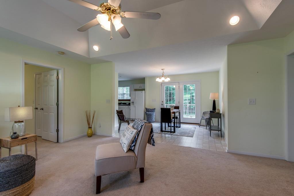 1427 St Paul Road Charlotte, TN 37036 - Photo 7 of 27 a living room with furniture and a chandelier