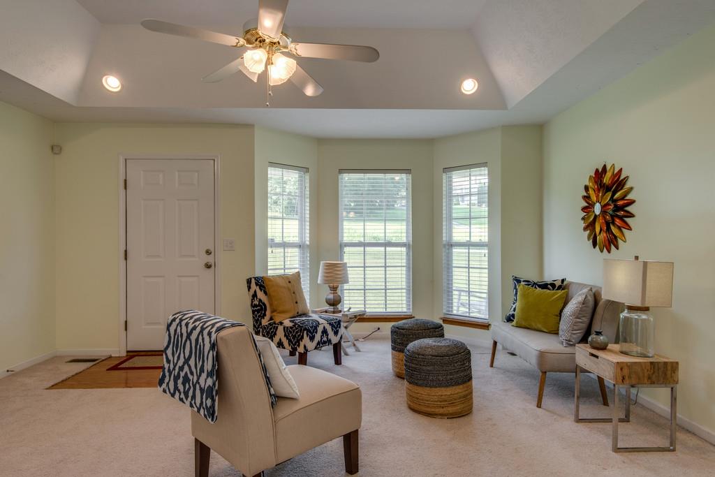 1427 St Paul Road Charlotte, TN 37036 - Photo 8 of 27 a living room with furniture and a large window