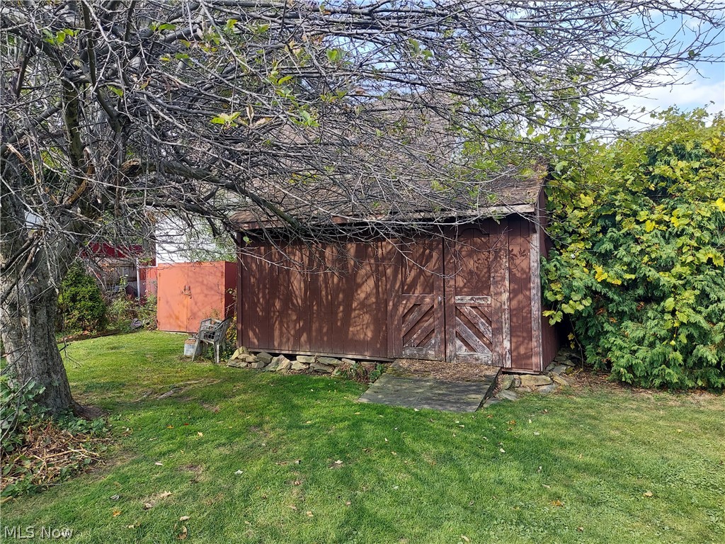 949 North Ridge Road Lorain, OH 44055 - Photo 6 of 33 Shed behind garage for storage of lawn mower, snow blower & tools