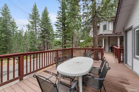 a view of a house with a yard covered in snow