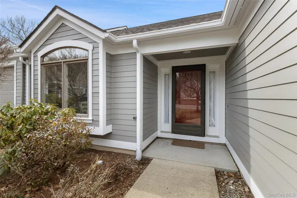 a view of a house with a snow in a yard