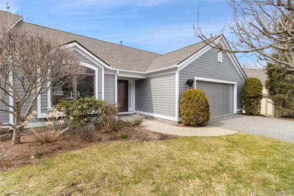 a view of large house with a yard