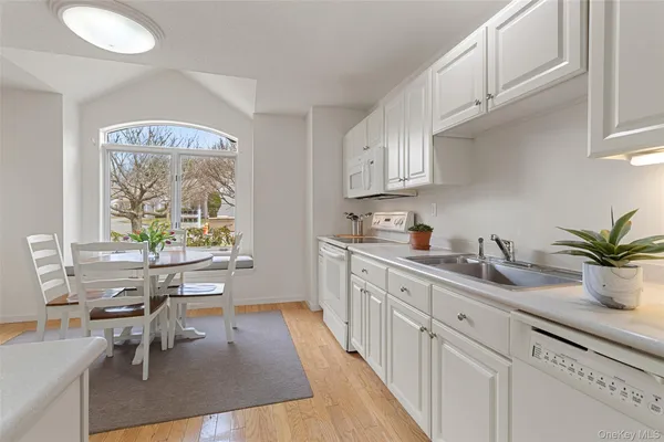 a view of kitchen with table and chairs