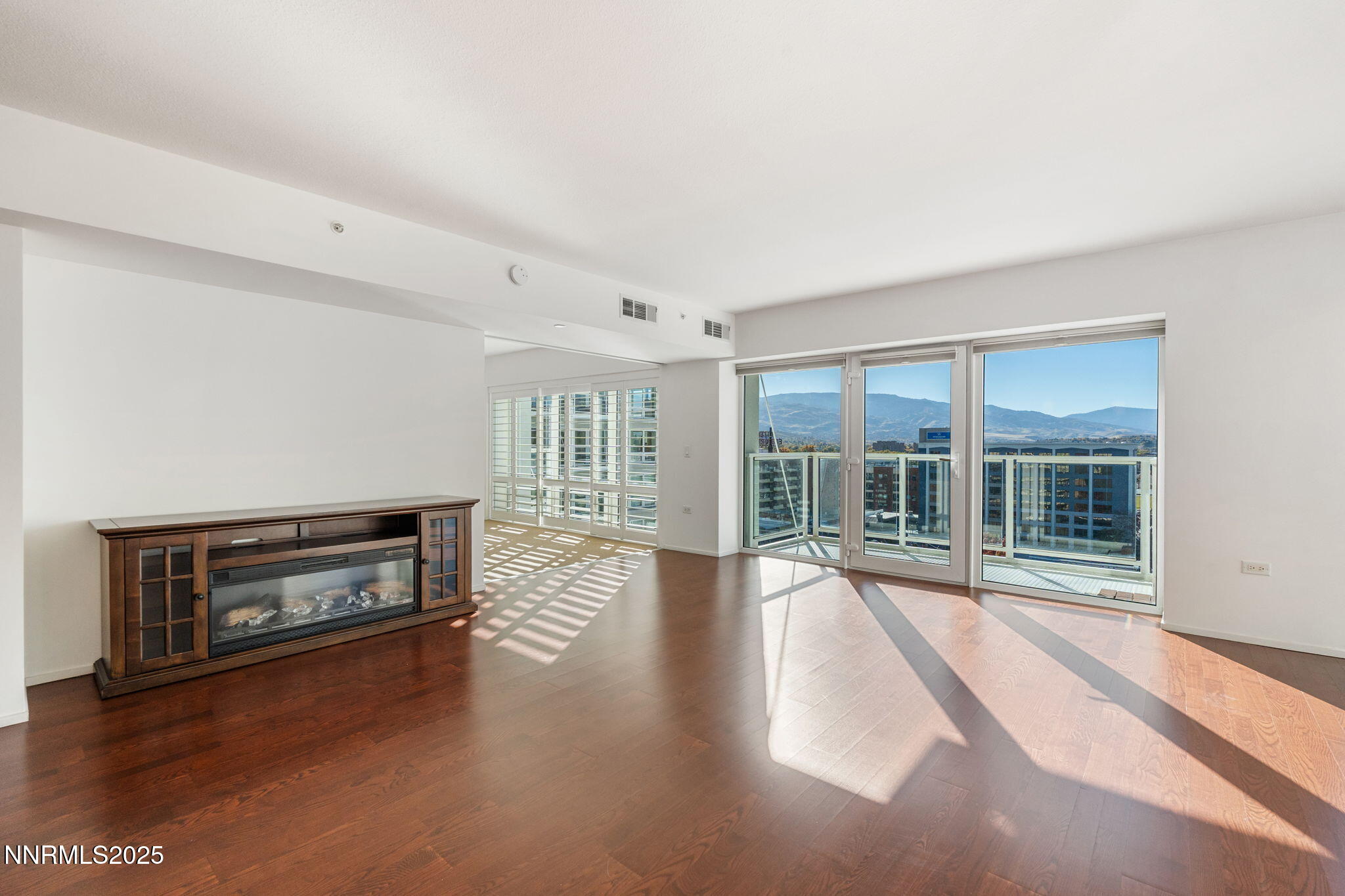 255 North Sierra Street, Unit 1012 Reno, NV 89501 - Photo 13 of 32 wooden floor in an empty room with a window