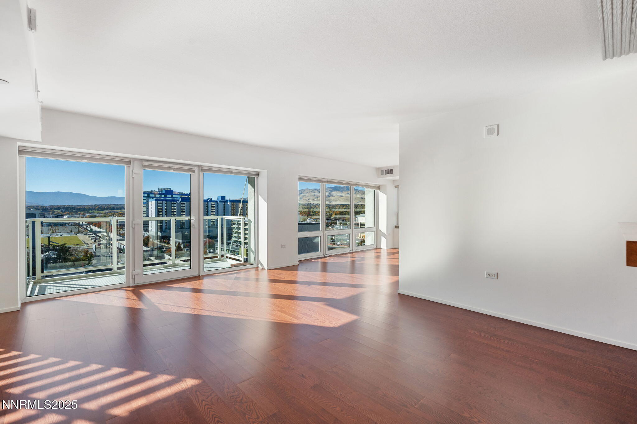 255 North Sierra Street, Unit 1012 Reno, NV 89501 - Photo 14 of 32 wooden floor in an empty room with a window