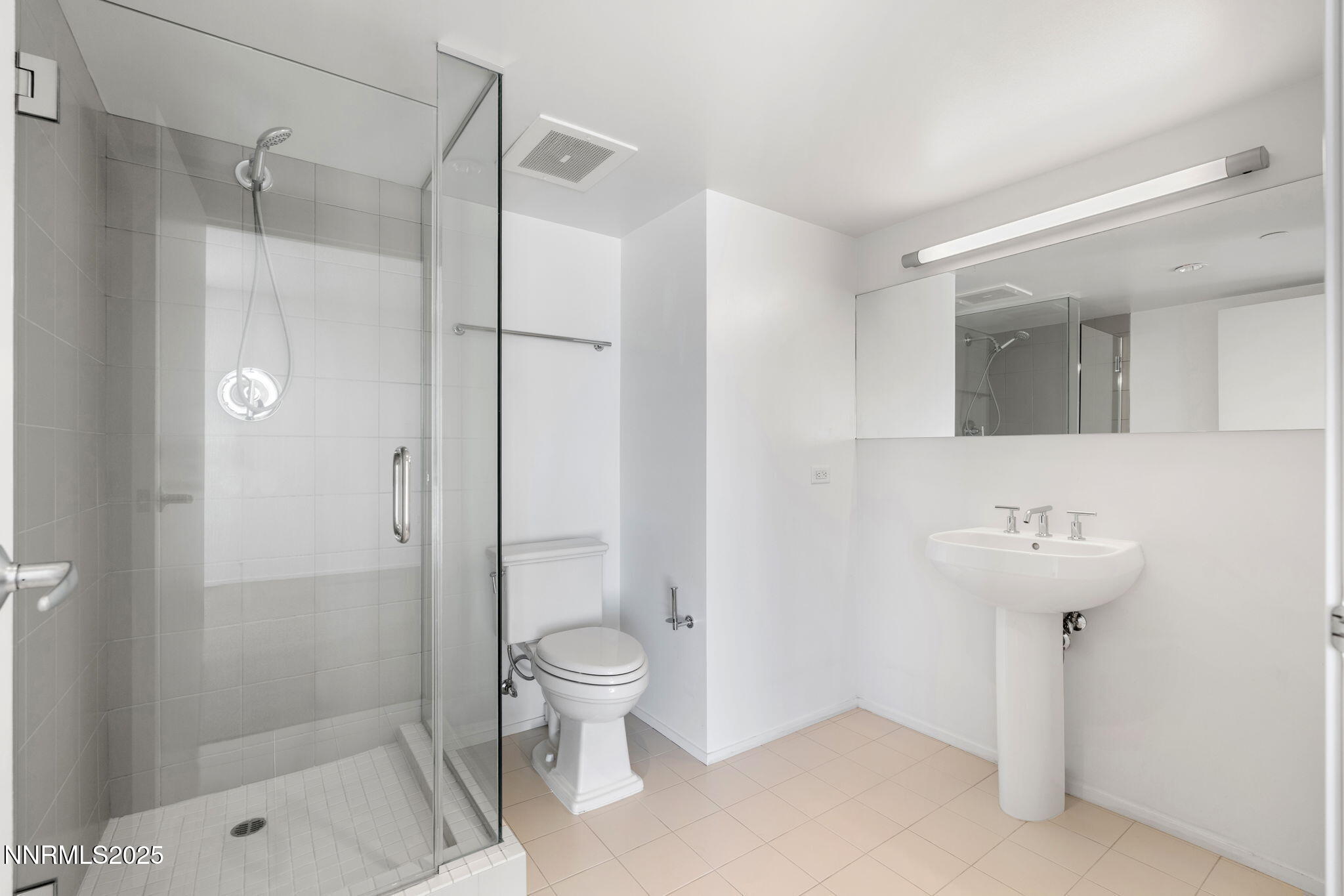 255 North Sierra Street, Unit 1012 Reno, NV 89501 - Photo 19 of 32 a bathroom with a shower a sink and toilet