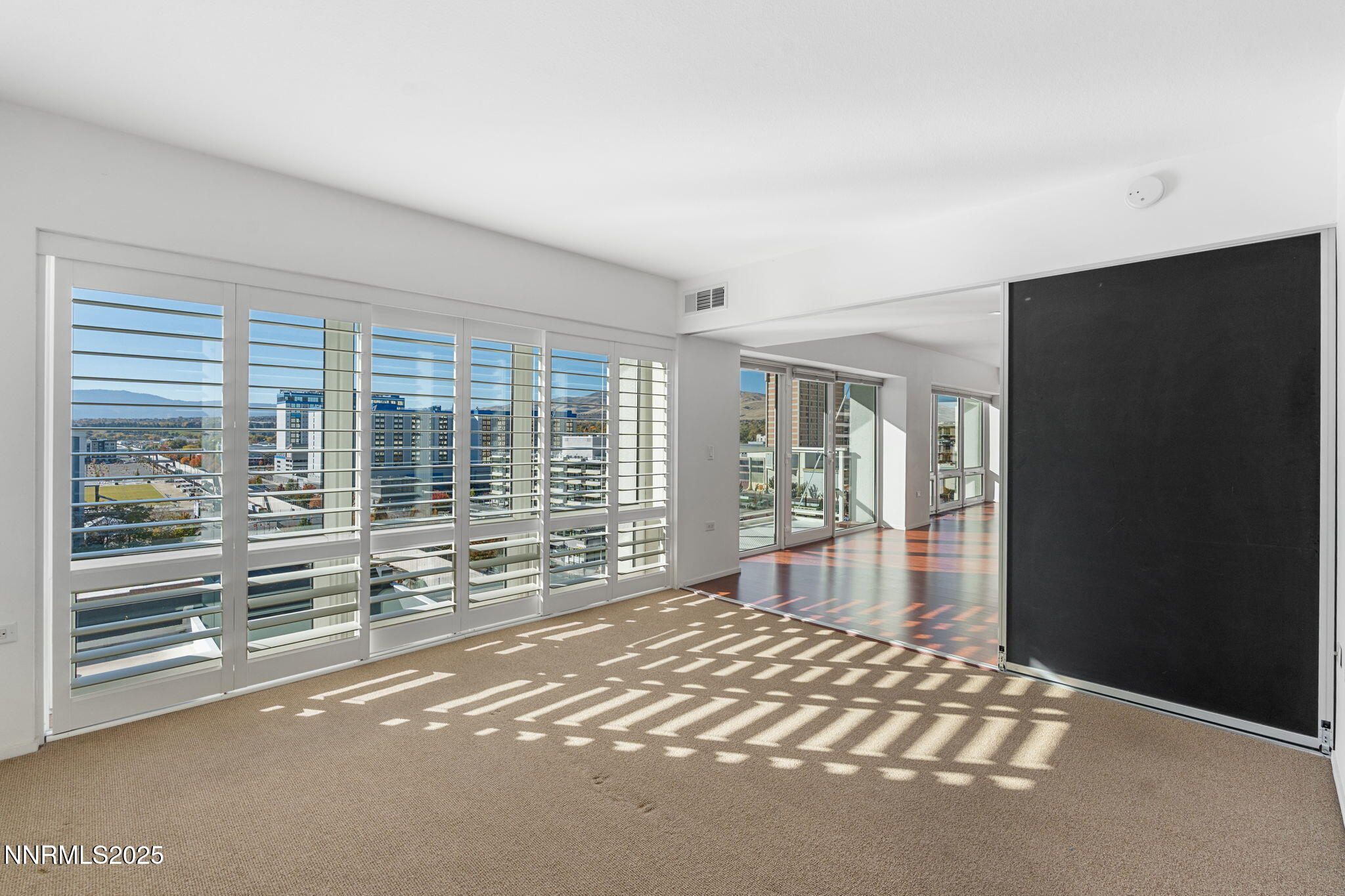 255 North Sierra Street, Unit 1012 Reno, NV 89501 - Photo 20 of 32 a view of empty room with floor to ceiling window