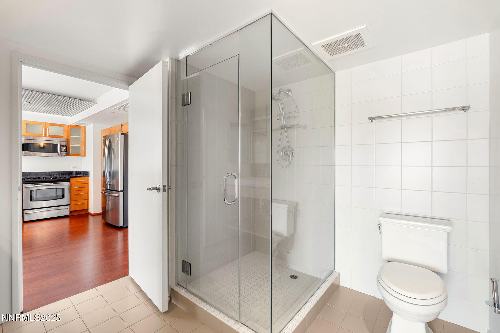 255 North Sierra Street, Unit 1012 Reno, NV 89501 - Photo 23 of 32 a bathroom with a shower and a toilet