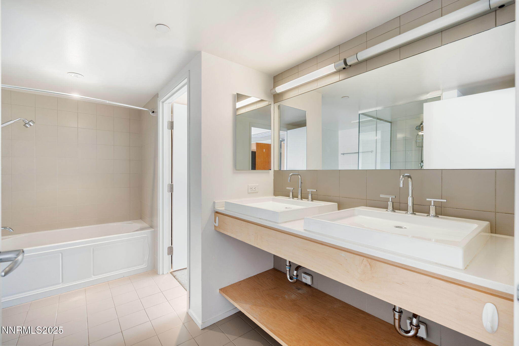 255 North Sierra Street, Unit 1012 Reno, NV 89501 - Photo 24 of 32 a bathroom with a sink and a mirror