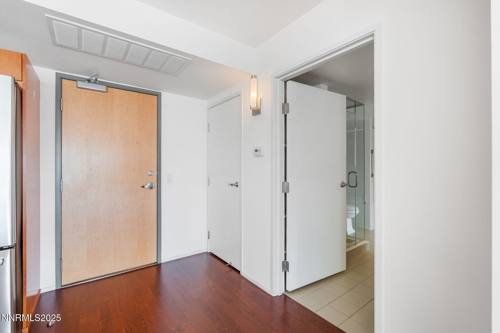 255 North Sierra Street, Unit 1012 Reno, NV 89501 - Photo 3 of 32 a view of an empty room with wooden floor and a window