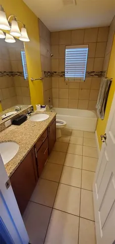 a bathroom with a sink and a washing machine