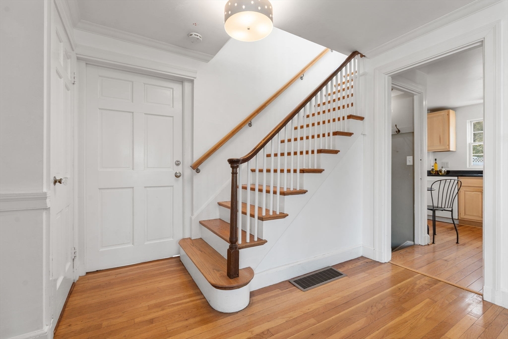 73 Roundwood Road Newton, MA 02464 - Photo 15 of 42 a view of entryway with wooden floor