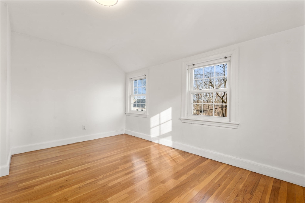 73 Roundwood Road Newton, MA 02464 - Photo 17 of 42 an empty room with windows